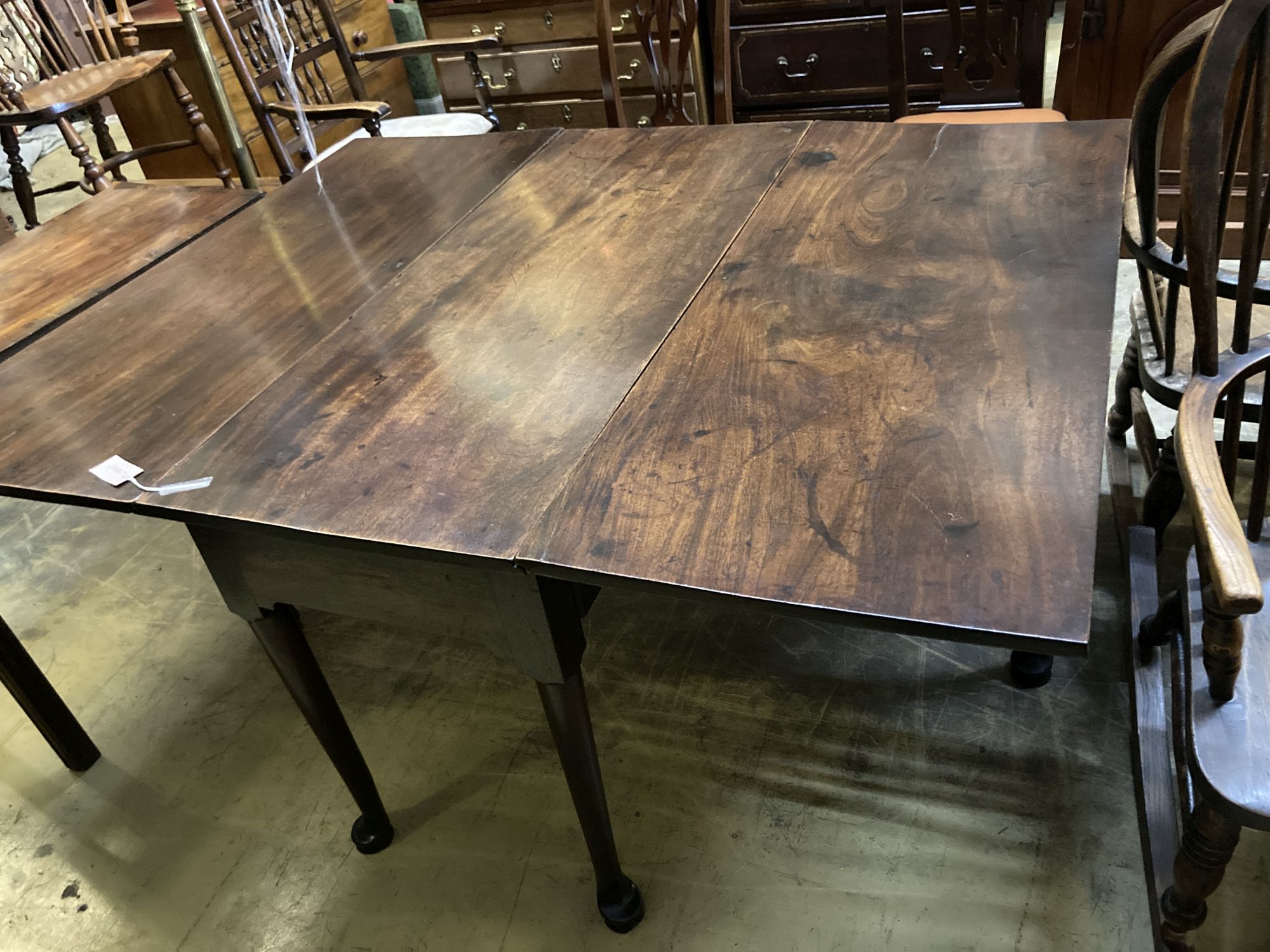 A George III mahogany pad foot drop leaf dining table, width 117cm, length 149cm extended, height 72cm